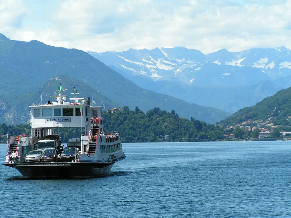 Lago Maggiore: Car Ferry across Lake Maggiore from Verbania (Piemonte) to Laveno (Lombardia). In the background Monte Rosa mountain chain and Verbania