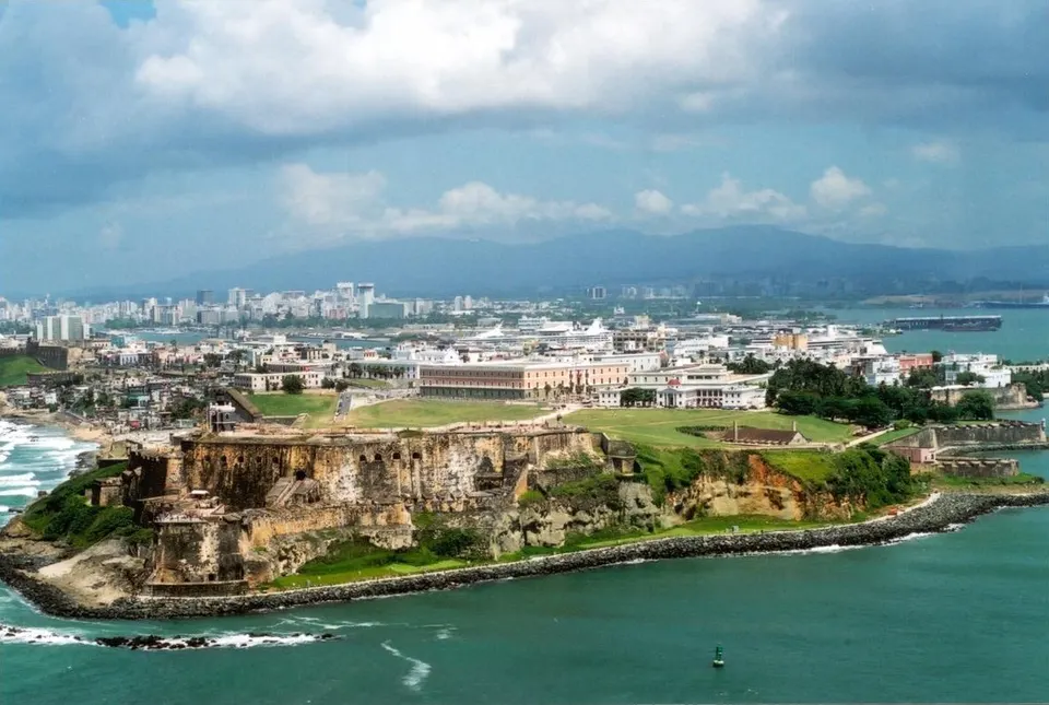 Puerto Rico: Aeriel view of Old San Juan with the Luquillo Mountain Range (Sierra de Luquillo) in the background.