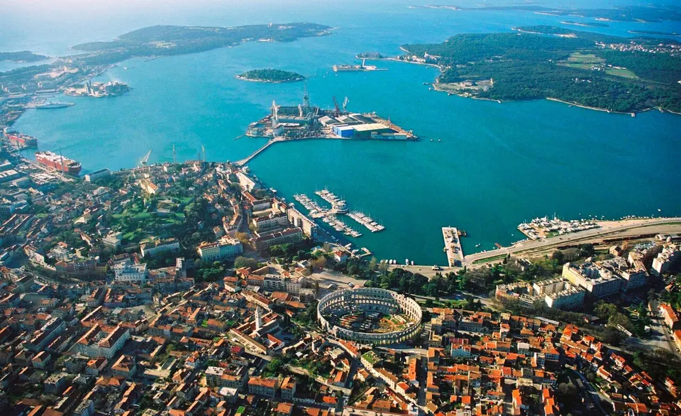 Pula: Aerial view of Pula, Croatia. The most notable object, on the bottom of the photo, is the Arena Amphiteathre. Left of it is the hill around